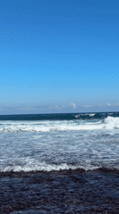 Clear morning brings large waves to Kuta Selatan beach