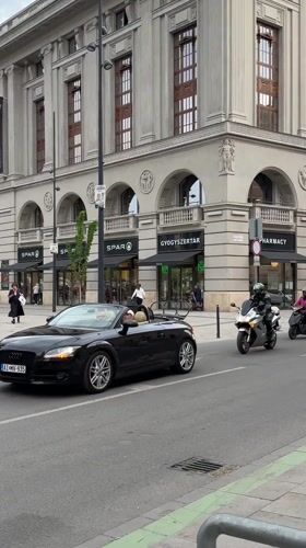 Electric scooter rider documented in central Budapest street scenes