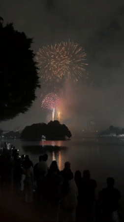 Crowds watch colorful fireworks display over Hanoi waterfront