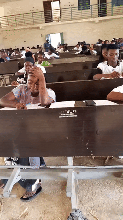 Students take exam in Akwanga classroom