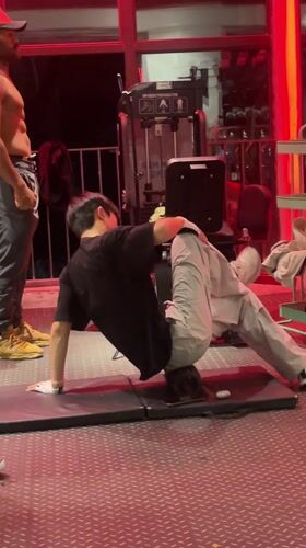 Person performs back exercises in Chongqing gym
