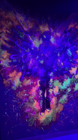 Black light art installation features glowing weapons in Batumi