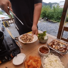 Korean BBQ lettuce wraps cooked and eaten outdoors in Dunnae-myeon