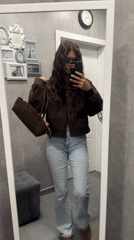 Woman records mirror selfie video in Moscow