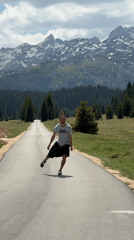 Man performs backflips on mountain road in Montenegro