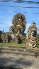 Traditional Balinese temple with checkered cloth documented in Sukawati