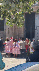 Wedding celebration with marching band outside Barcelona church