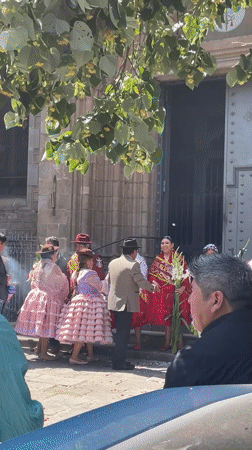 Wedding celebration with marching band outside Barcelona church