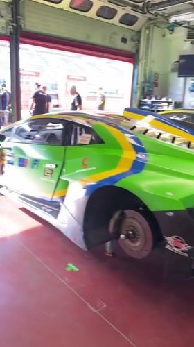 Lamborghinis in race livery parked up in a Scarperia garage