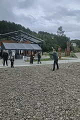 Folk festival with reenactors, rope games, and carved sculptures in Magadan