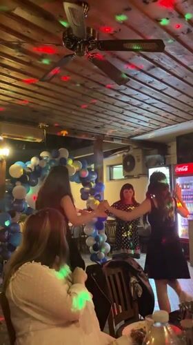 Young adults celebrate with dancing at Karlovo restaurant party