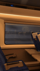 Train passenger documents rural countryside journey through farmland