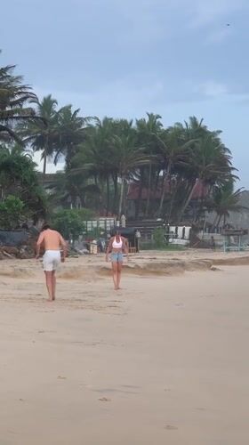 Couple plays soccer on Kathaluwa beach