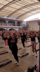 Step aerobics class in session at Los Olivos indoor gym
