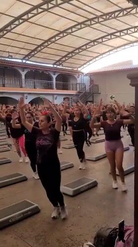 Step aerobics class in session at Los Olivos indoor gym