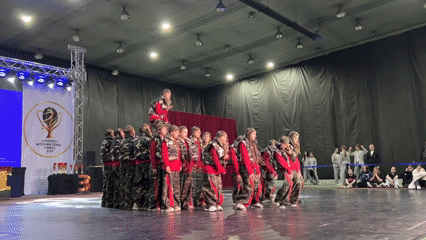 Dance groups perform coordinated routines at Chișinău venue