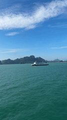 Ferry crossing the Gulf of Thailand past green island chain