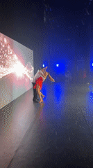 Multi-act dance showcase on a colorfully lit stage in Netanya