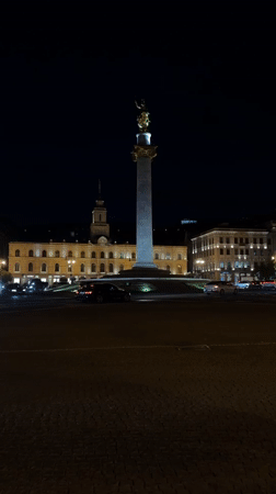 Evening monument and city lights observed in Tbilisi