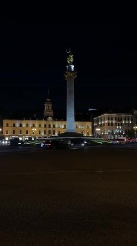 Evening monument and city lights observed in Tbilisi