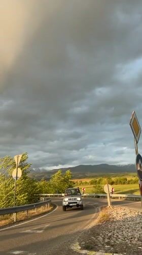 Silver SUV drives through scenic Bulgarian countryside near Barakovo