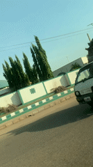 White truck carries sacks along road in Nigeria