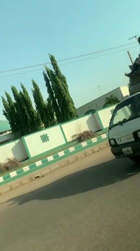 White truck carries sacks along road in Nigeria