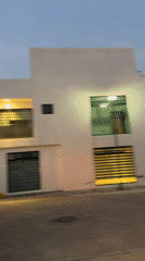 Modern white building documented at dawn in Cholula, Mexico