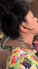 Person uses massage devices on neck and legs in Egypt