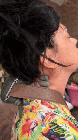 Person uses massage devices on neck and legs in Egypt