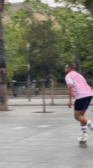 Inline skater performs barrier jump in Barcelona plaza