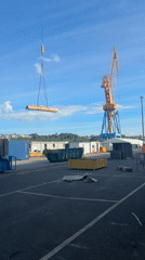 Shipyard workers conduct maintenance operations in Brest, France