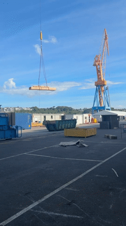 Shipyard workers conduct maintenance operations in Brest, France