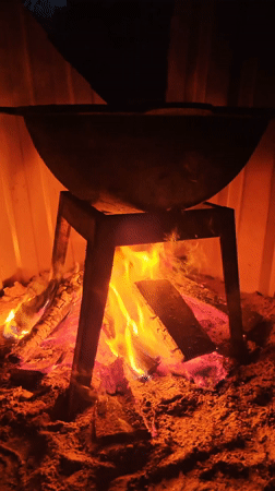 Outdoor cooking session over wood fire in Belarus