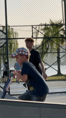 Children roller skate while adults play basketball in Fethiye