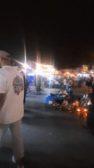 Evening pedestrian activity captured in central Marrakesh