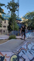 Skateboarder performs tricks at Barcelona skate park