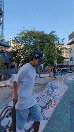 Skateboarder performs tricks at Barcelona skate park