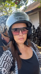 Scooter ride through Sukawati with a roadside Ganesha statue