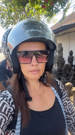 Scooter ride through Sukawati with a roadside Ganesha statue