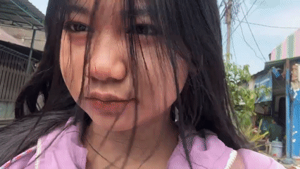 Woman records selfie videos on North Jakarta street