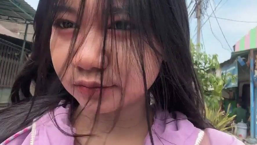 Woman records selfie videos on North Jakarta street
