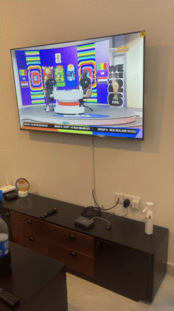 TV broadcast playing in a Dar es Salaam living room