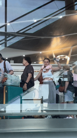Airport scenes captured at Phuket showing travelers and architecture