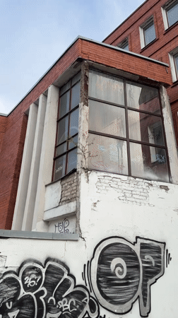 Brick building with graffiti documented in Riga