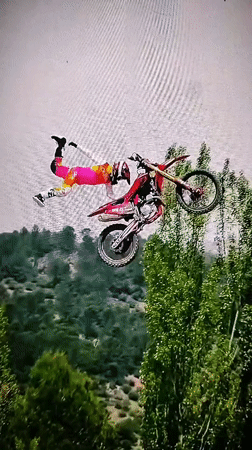Dirt bike rider performs aerial stunt in Padarsko, Bulgaria