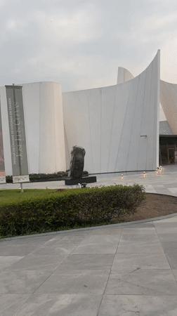 Modern white building with sculpture documented in Tlaxcalancingo