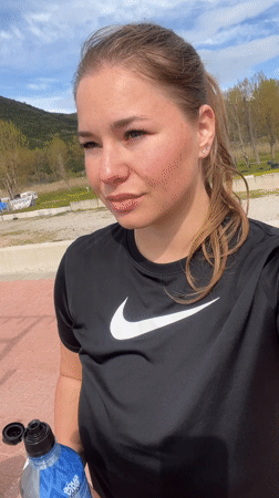 Woman hydrates outdoors in Montenegro mountain setting