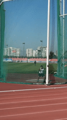 Woman competes in discus throw at Santiago athletics stadium