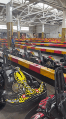 Indoor go-karting session with racing suits and track action